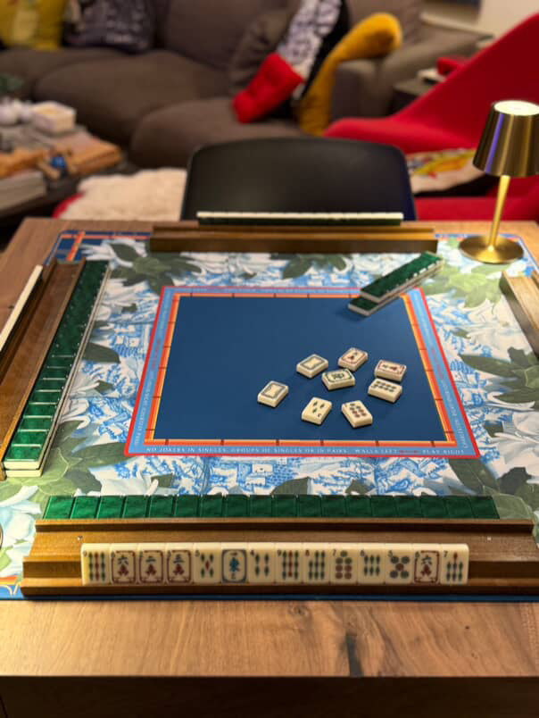 mahjong floral playing mat with tiles on a table