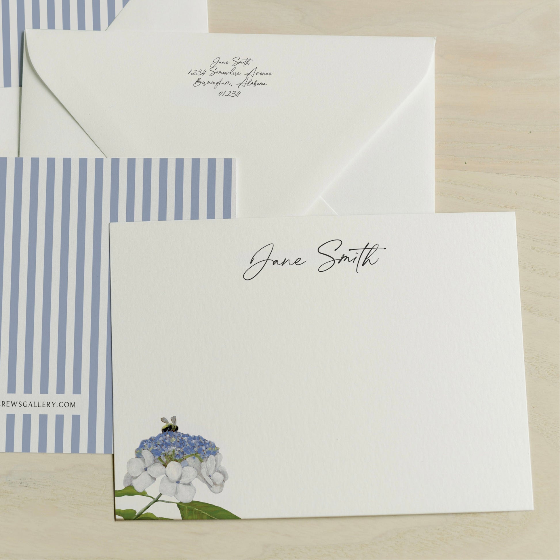 Personalized Stationery set with a card featuring a bee on a flower and an envelope with a striped design. Art by Amy Crews Gallery