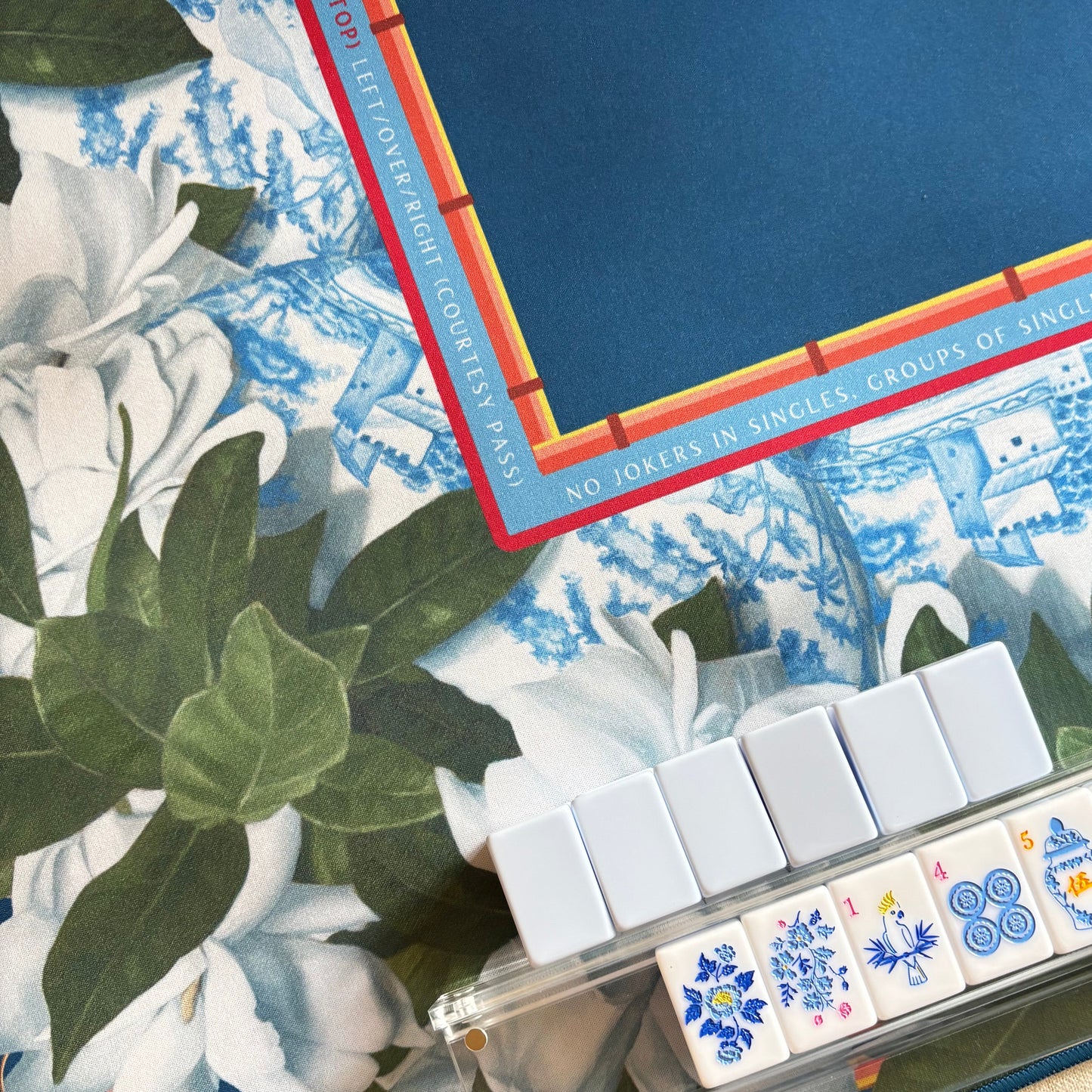 Close up of mahjong mat by Amy Crews and chinoiserie tiles by Mahj Squad.