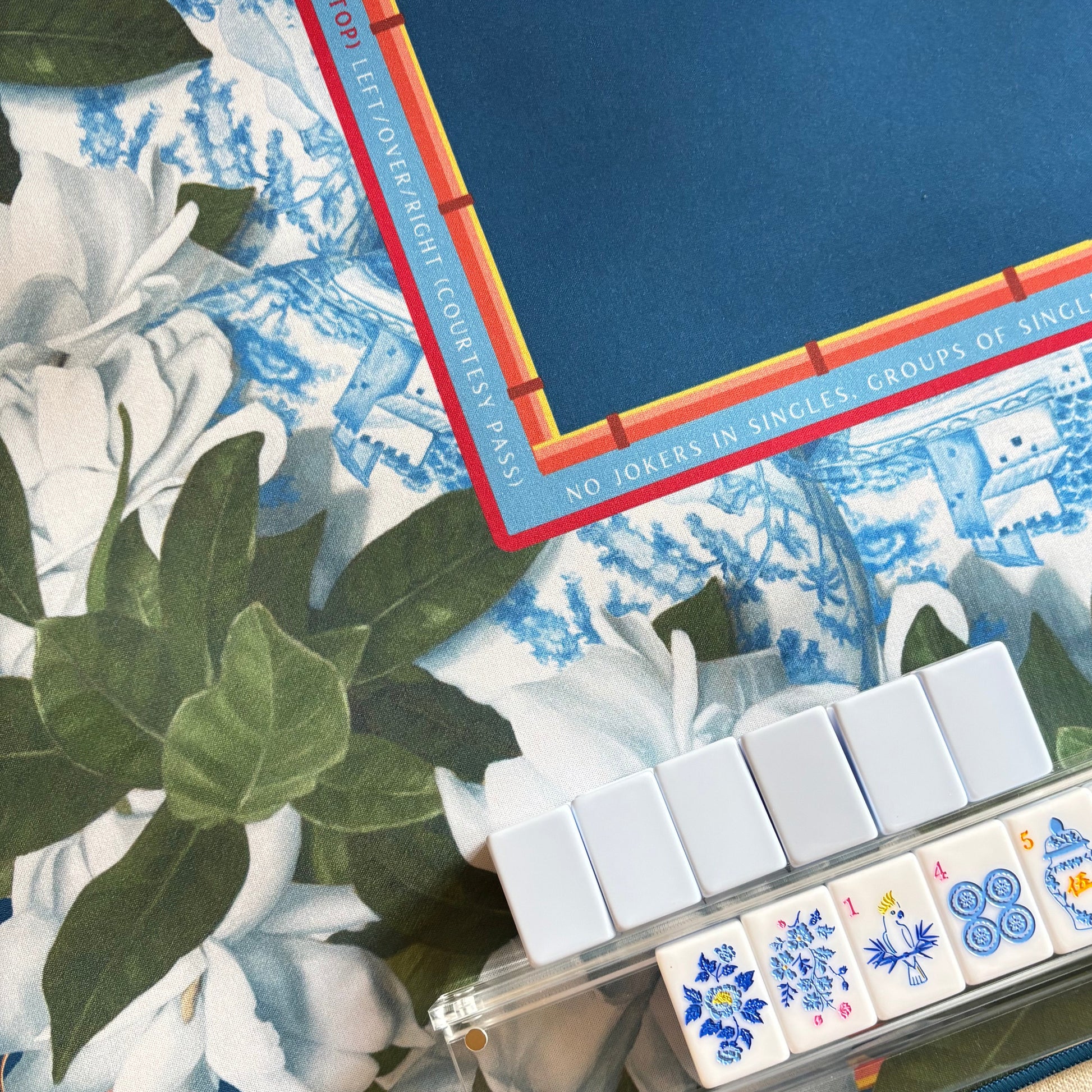 Close up of mahjong mat by Amy Crews and chinoiserie tiles by Mahj Squad.