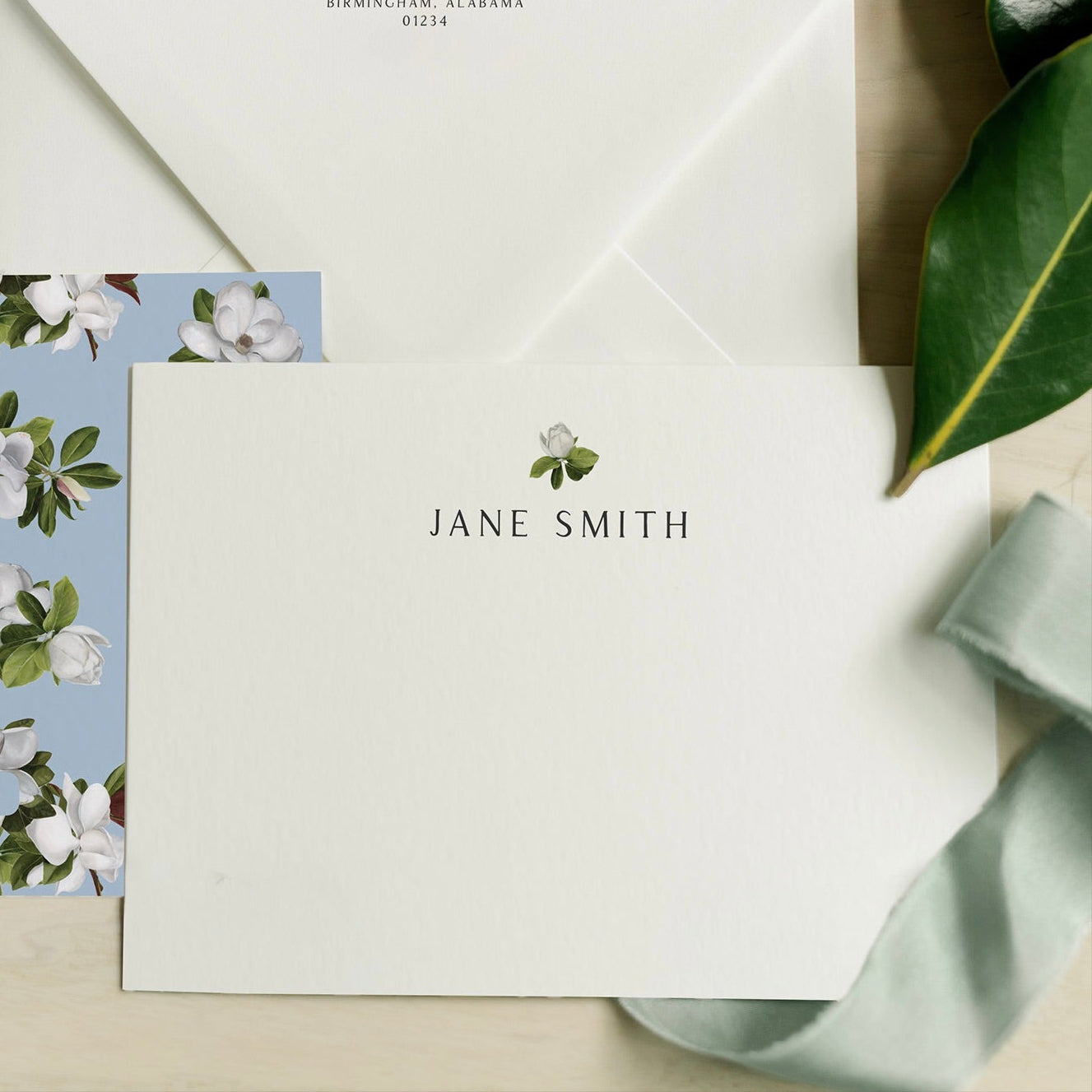 Stationery set with a card, envelope, and ribbon featuring a floral design - Amy Crews Art